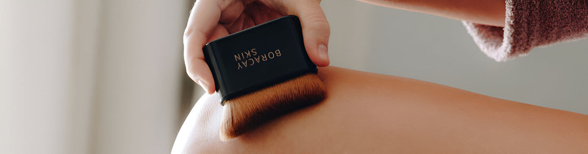 Woman Applies Boracay Skin's Body Oil With a  Kabuki Brush
