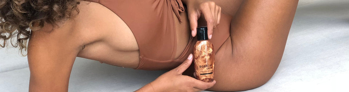 Woman holding Boracay Skin shimmer body oil
