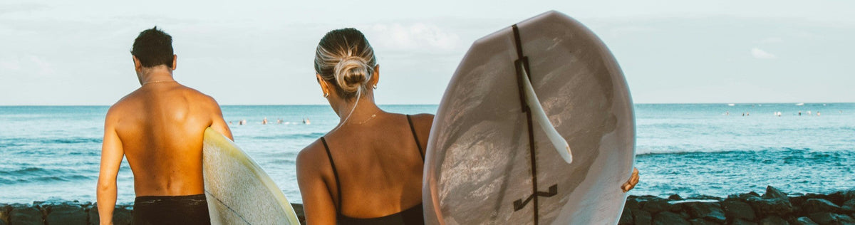 surfers with glowing skin at the beach